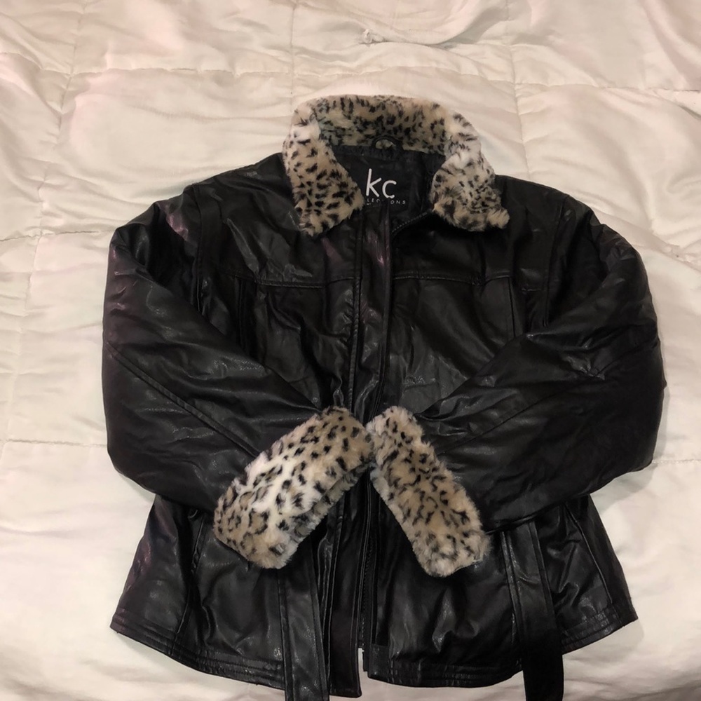 Black faux leather jacket with jaguar faux fur collar and cuff linings.